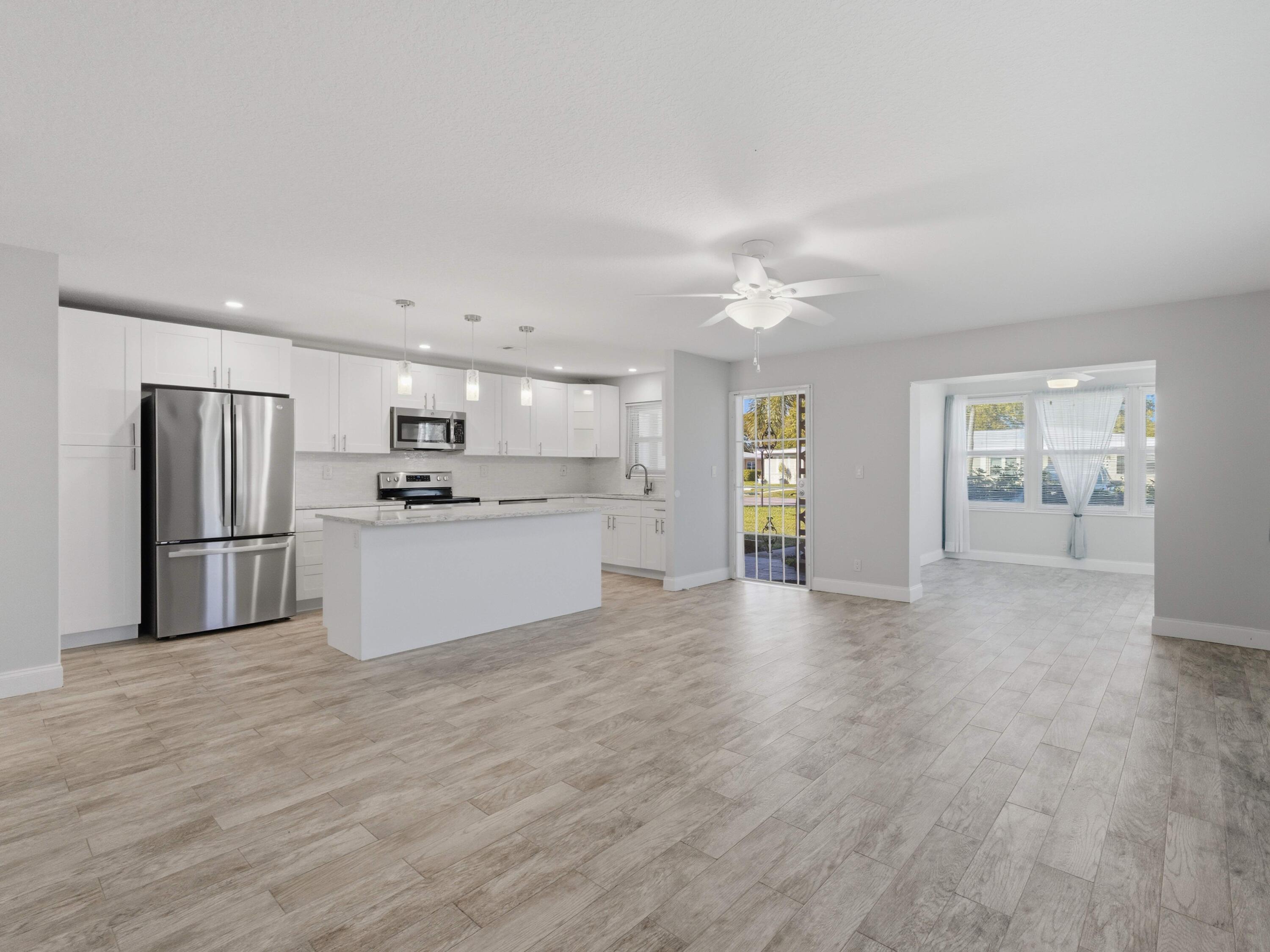 270 High Point Boulevard, Unit A Boynton Beach, FL 33435 - Photo 8 of 44 a view of kitchen with wooden floor
