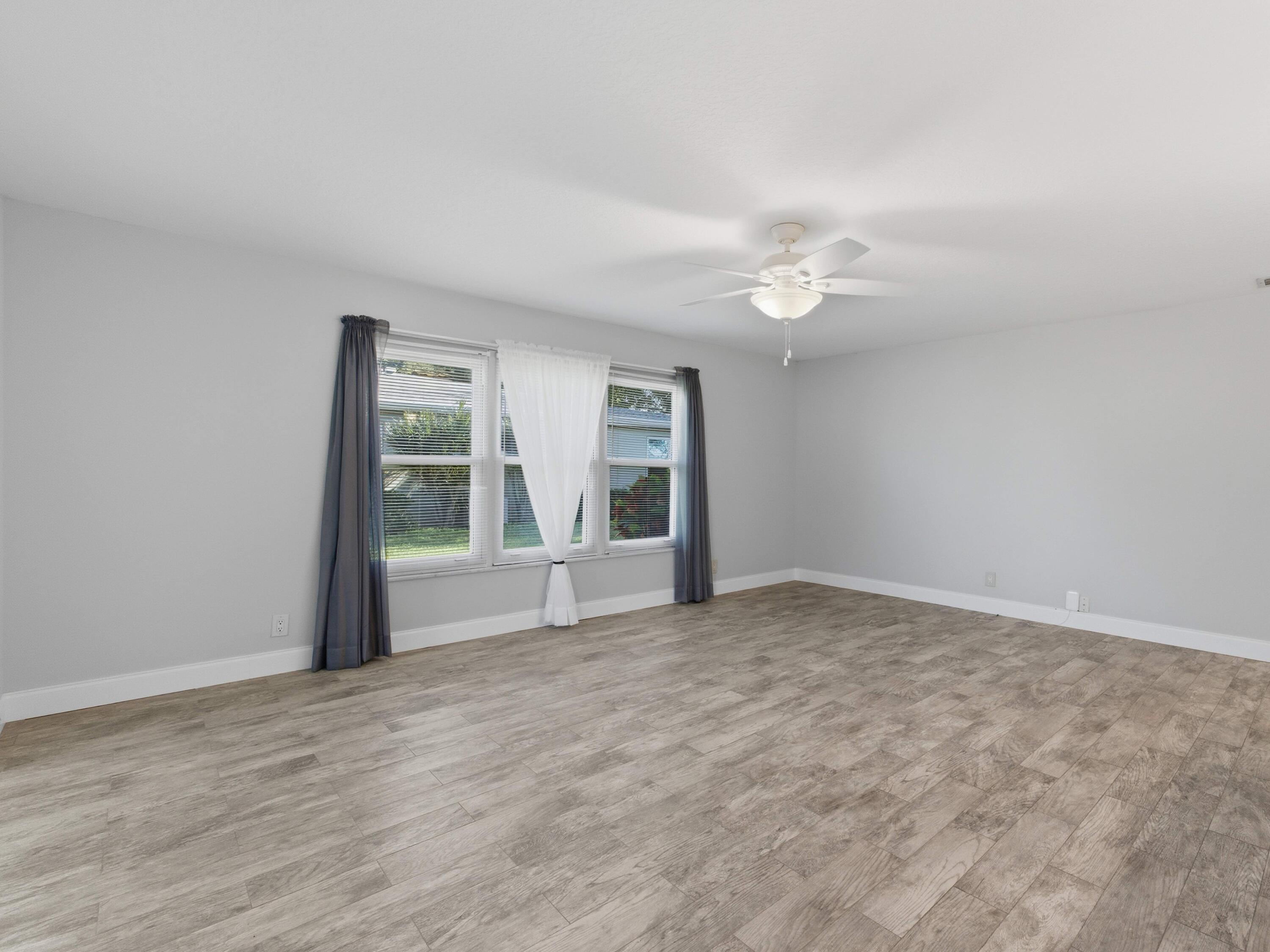 270 High Point Boulevard, Unit A Boynton Beach, FL 33435 - Photo 9 of 44 a view of an empty room with a window