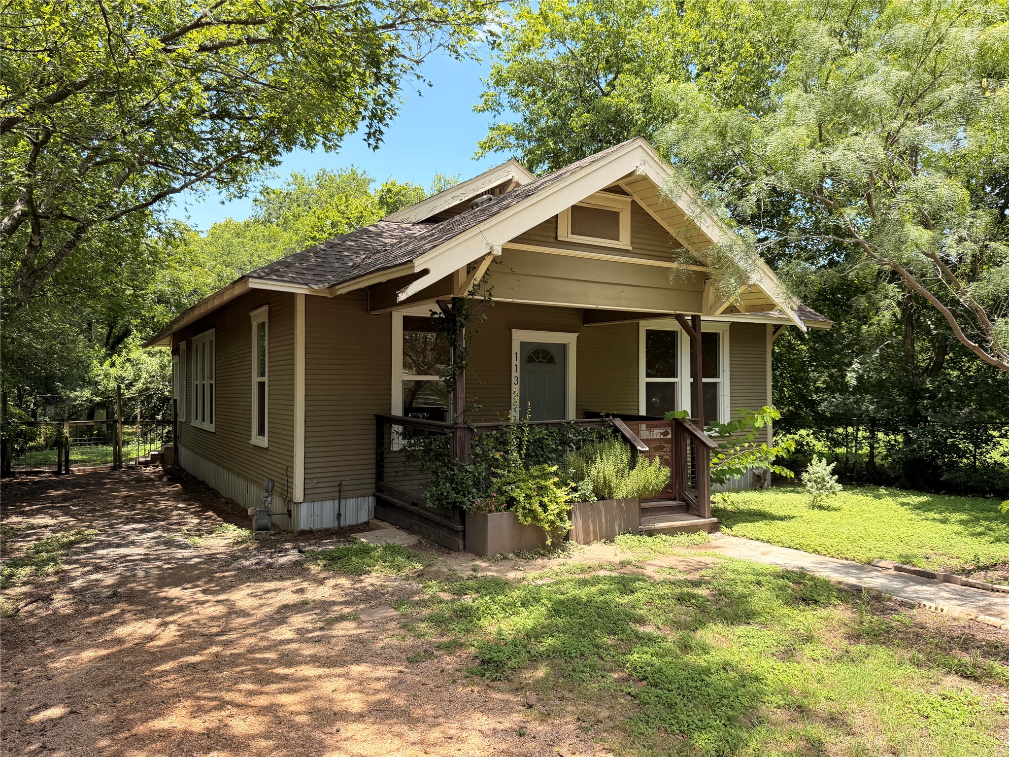1136 Eleanor Street Austin, TX 78721 - Photo 3 of 30 Discover a charming home nestled among lush trees, offering a serene escape.