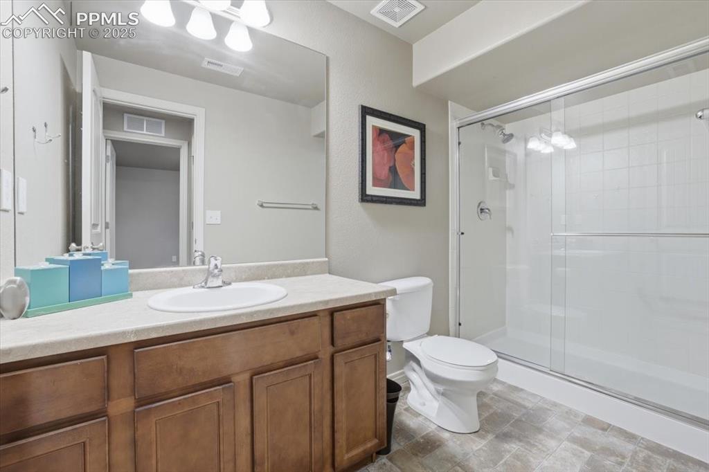 2374 Cinnabar Road Colorado Springs, CO 80921 - Photo 45 of 48 The basement level bath has a large double shower and lots of counter space.