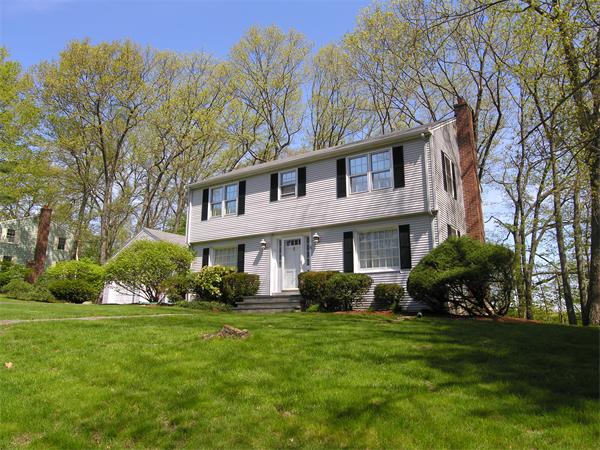 15 Maugus Hill Road Wellesley, MA 02481 - Photo 1 of 1 a front view of house with yard and green space