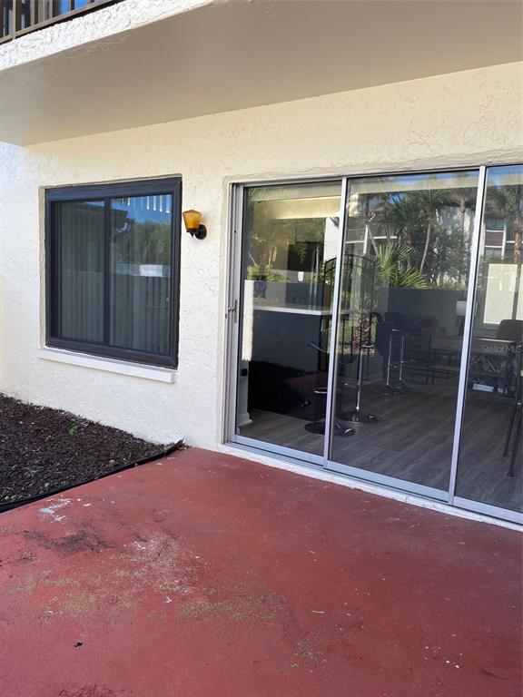 2209 Belleair Road, Unit C21 Clearwater, FL 33764 - Photo 19 of 23 a view of an empty room with glass door