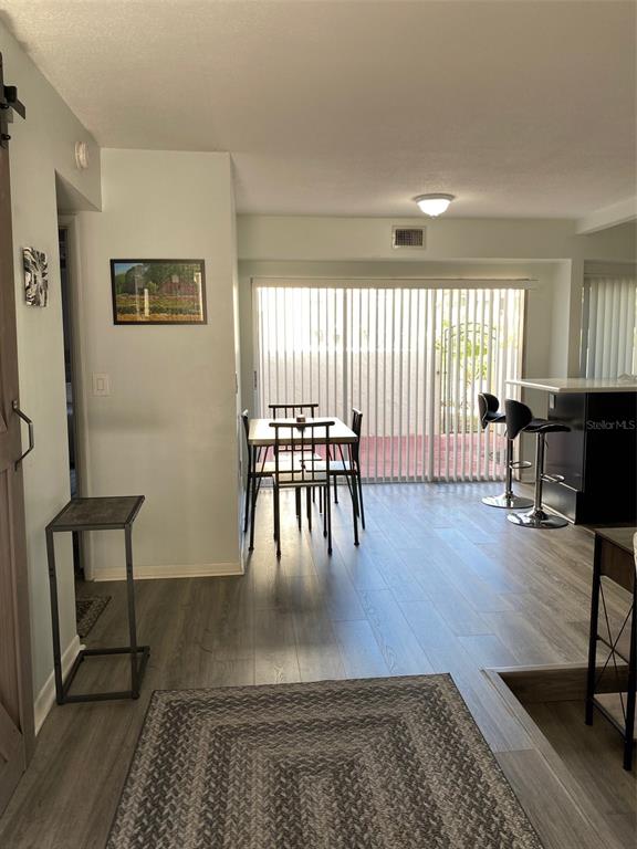 2209 Belleair Road, Unit C21 Clearwater, FL 33764 - Photo 7 of 23 a living room with furniture and a table