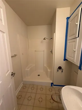 a bathroom with a sink and a shower