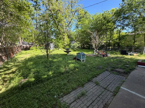 a house view with swimming pool in front of it