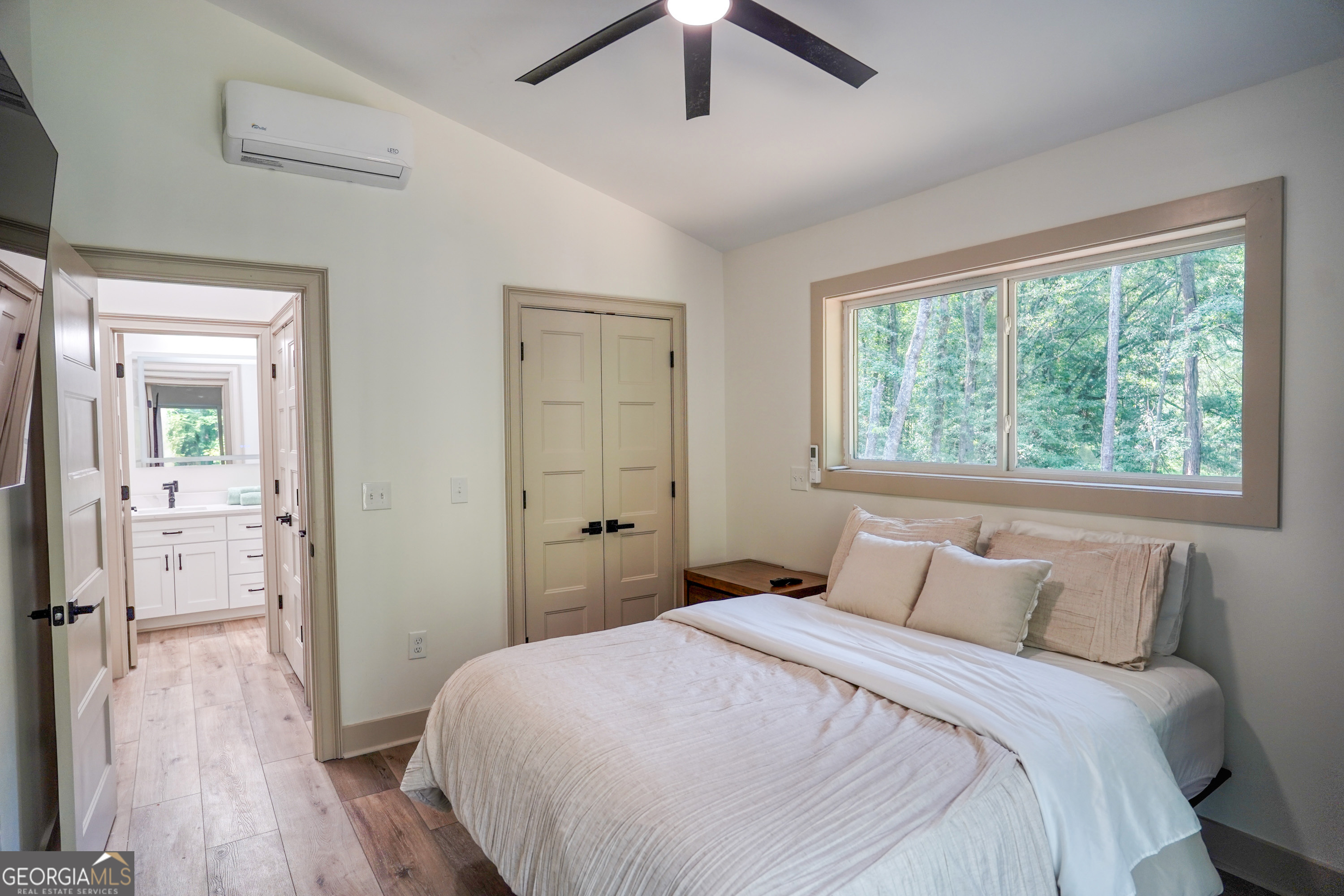 440 Palmetto Road Tyrone, GA 30290 - Photo 14 of 32 a bedroom with a bed and a wooden floor