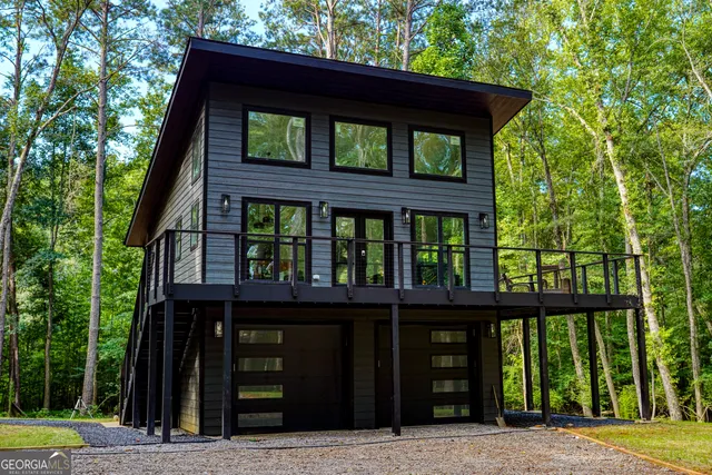 front view of a house with a large window