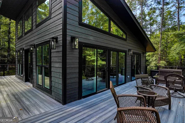 a view of a two chairs and table in the balcony