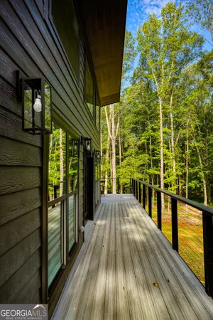 a view of balcony with wooden floor