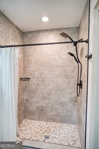 a view of a swimming pool with a large trees