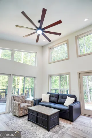 a living room with furniture and windows