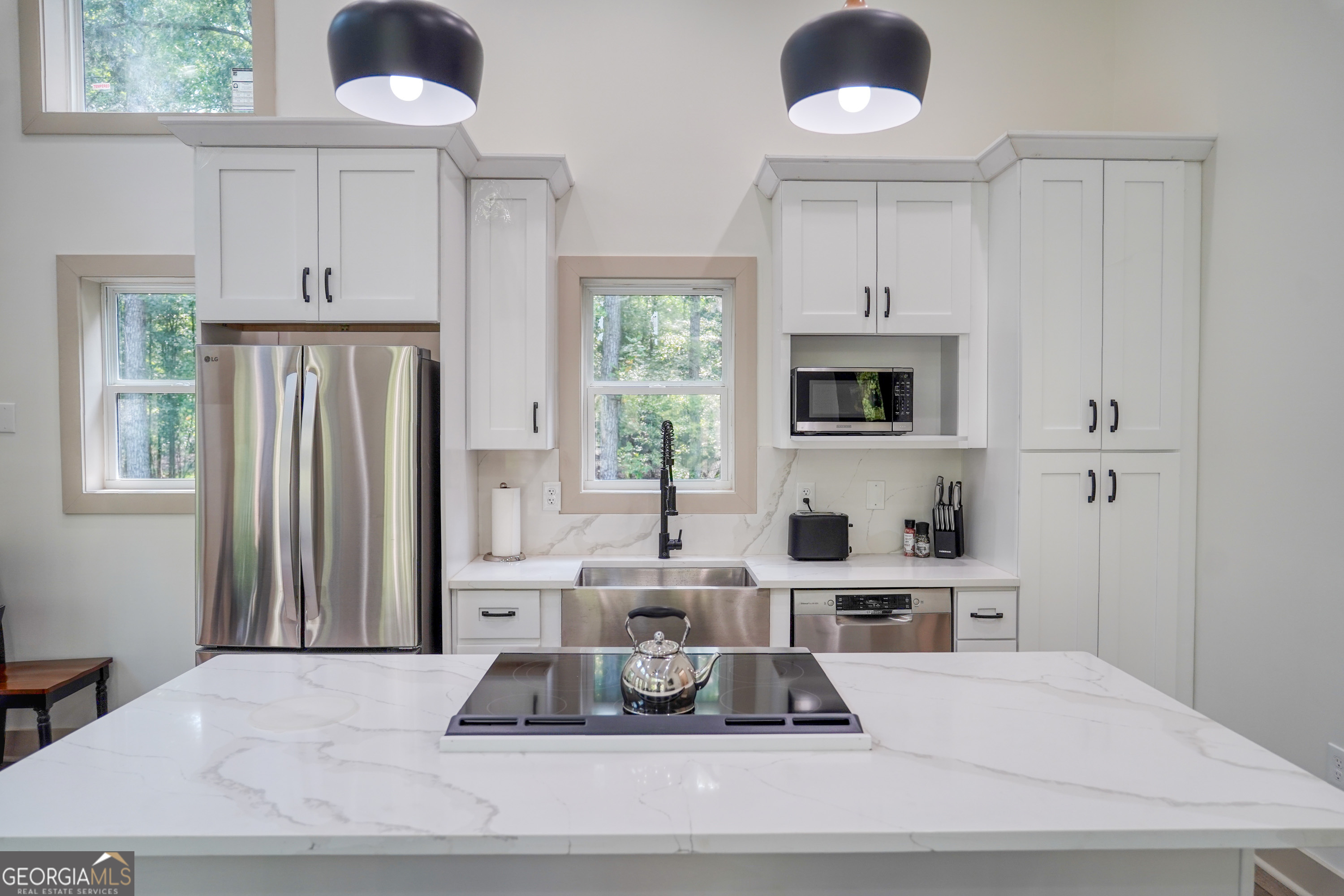 440 Palmetto Road Tyrone, GA 30290 - Photo 8 of 32 a living room with hard wood floors and a sink