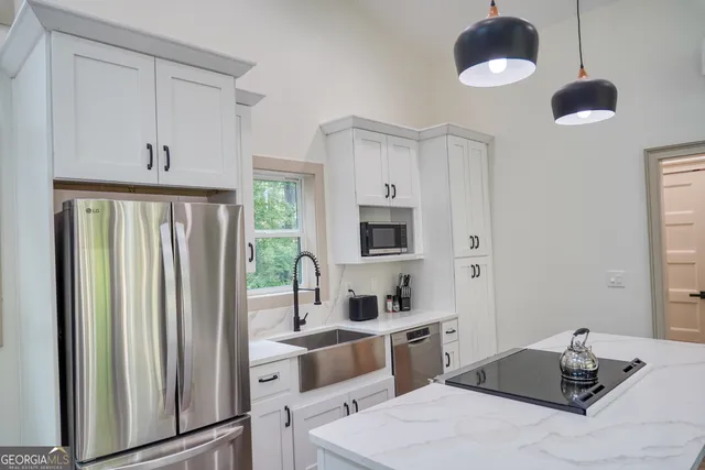 a room with a bed and a chandelier