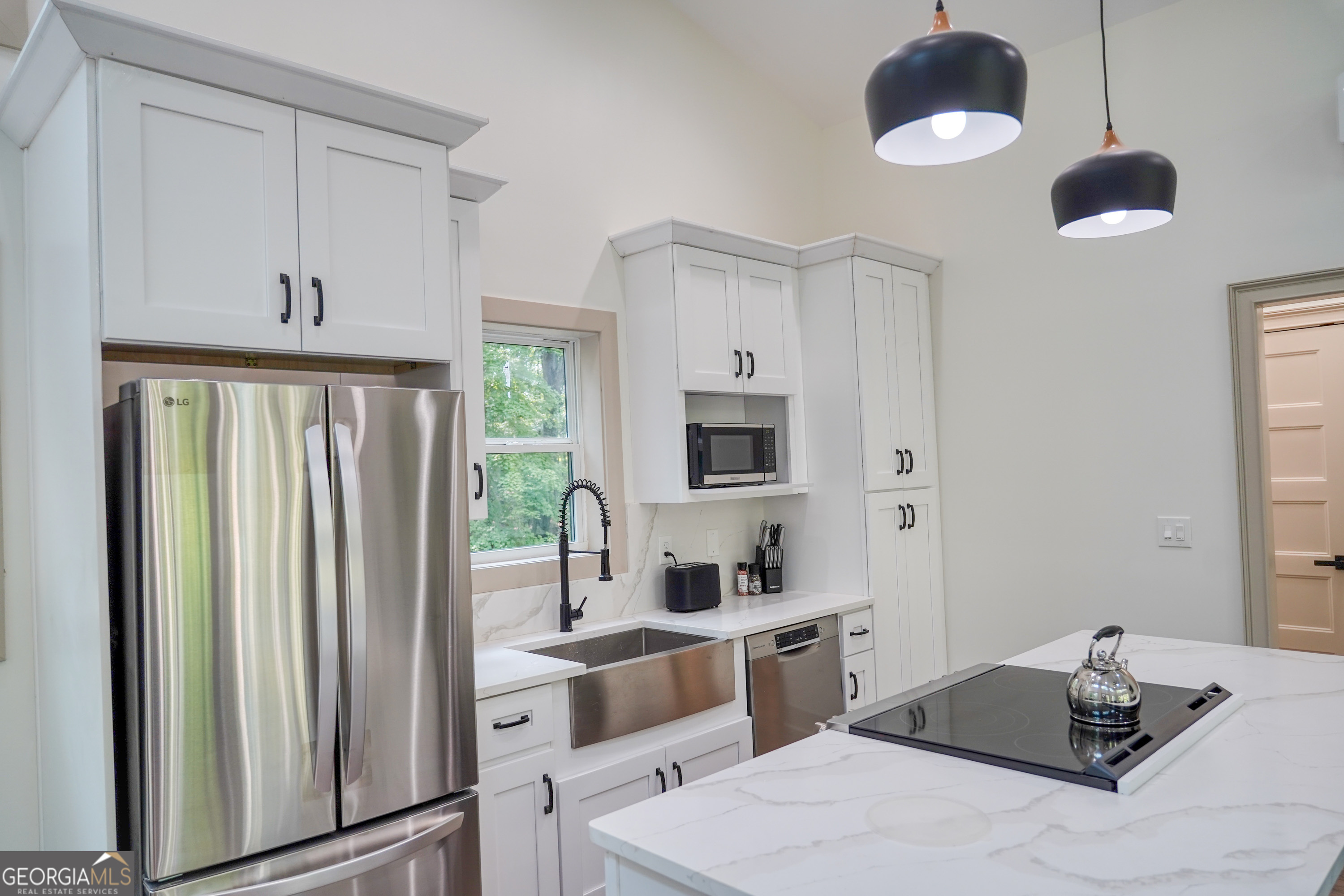 440 Palmetto Road Tyrone, GA 30290 - Photo 9 of 32 a room with a bed and a chandelier