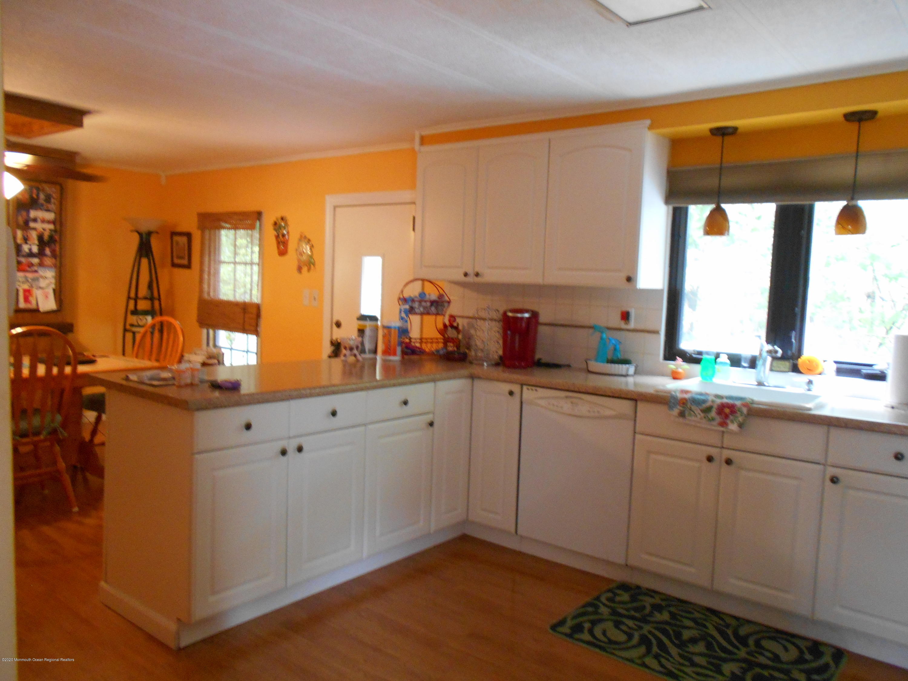 484 Rosalind Road Freehold, NJ 07728 - Photo 3 of 27 a kitchen with a sink cabinets and window