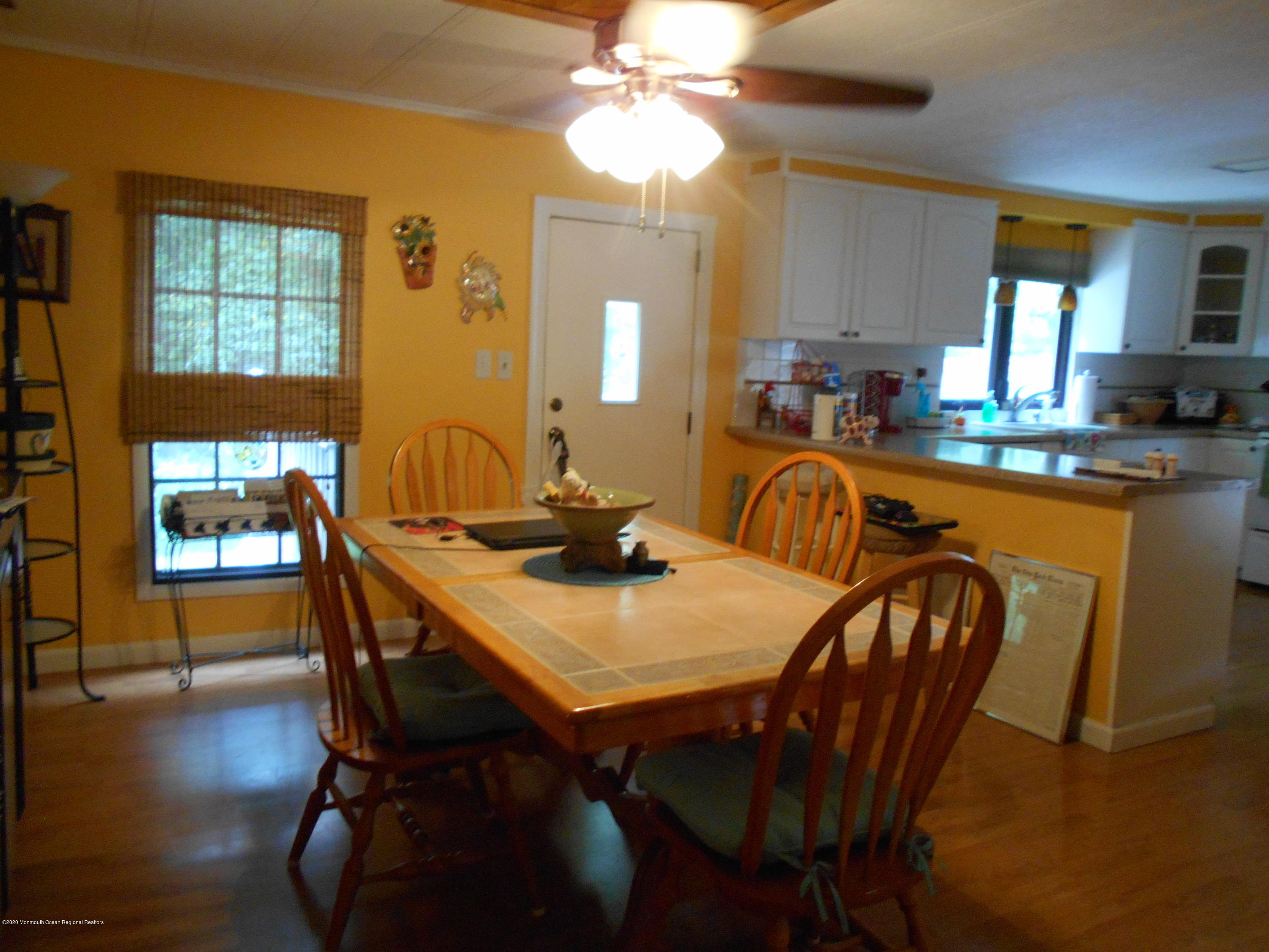 484 Rosalind Road Freehold, NJ 07728 - Photo 5 of 27 a view of a a dining room with furniture window and wooden floor