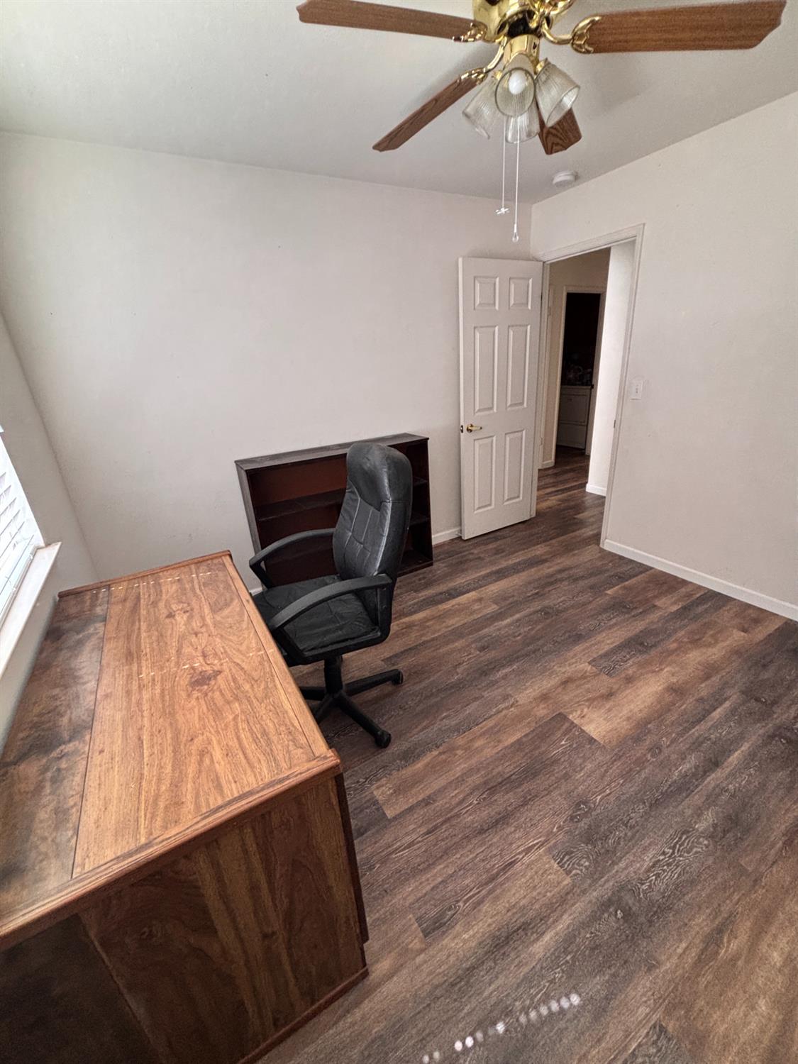 609 Merlot Avenue Madera, CA 93637 - Photo 19 of 45 a room with wooden floor and windows