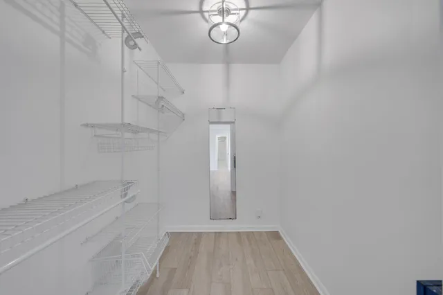 a view of a room with racks on the wall