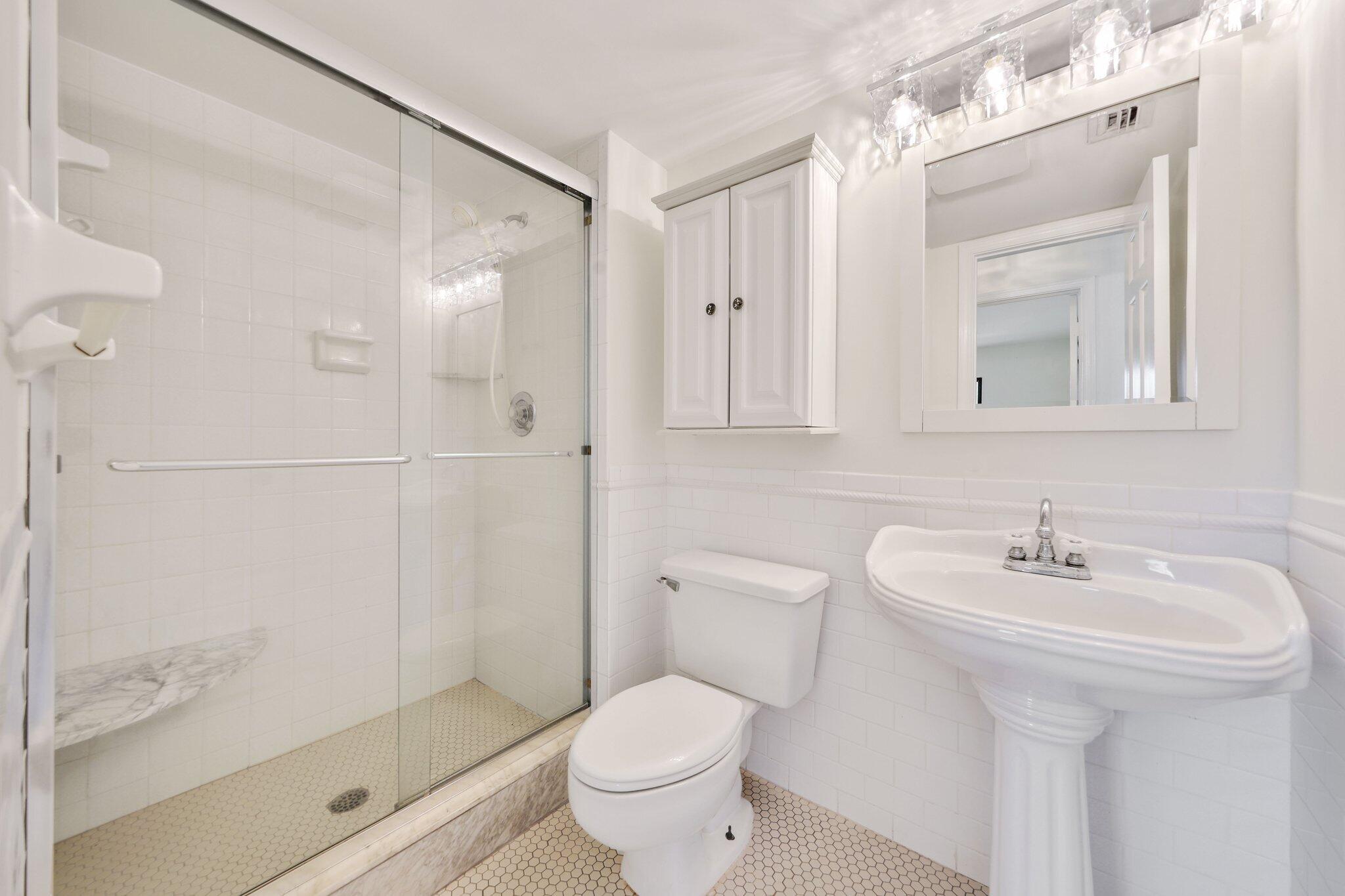 200 Intracoastal Place, Unit 206 Jupiter, FL 33469 - Photo 18 of 35 a bathroom with a sink toilet and shower