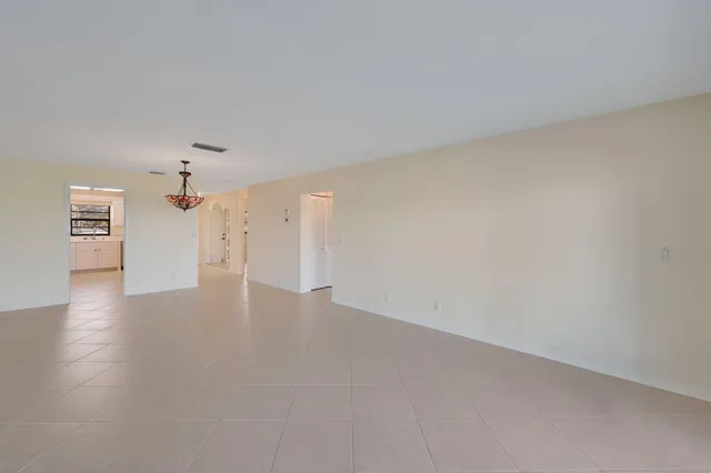 a view of a livingroom with a ceiling fan and window