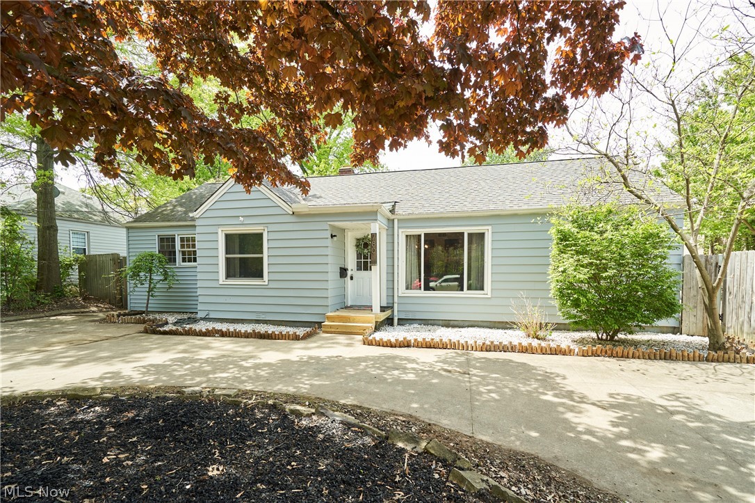 780 Bates Road Rocky River, OH 44116 - Photo 33 of 35 Light blue siding exterior featuring white trim windows and a white front door