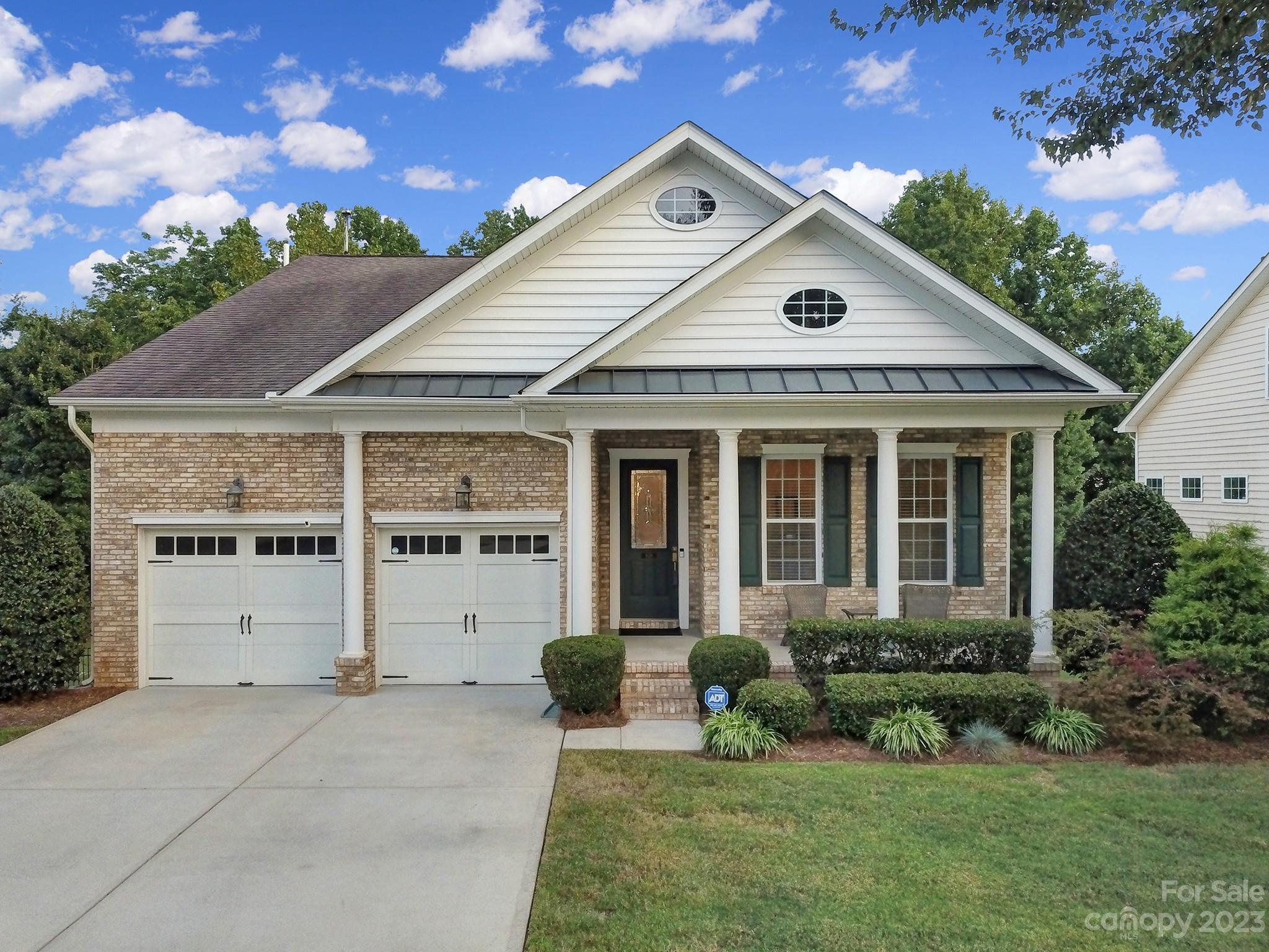 818 Treasure Court Fort Mill, SC 29708 - Photo 1 of 47 a front view of a house with a yard