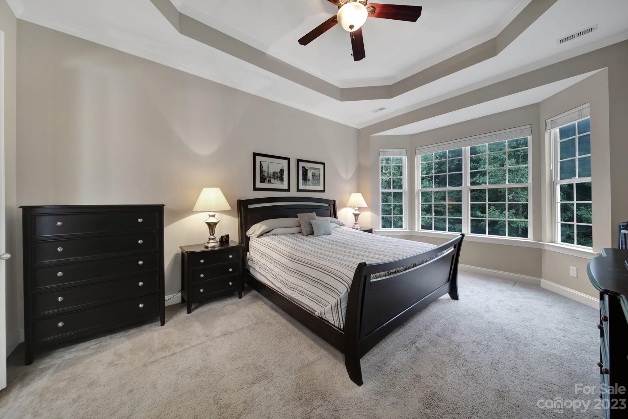 818 Treasure Court Fort Mill, SC 29708 - Photo 12 of 47 a large bedroom with a bed and a large window