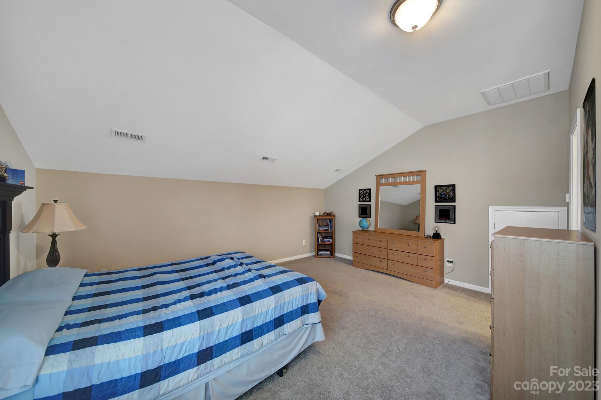 818 Treasure Court Fort Mill, SC 29708 - Photo 17 of 47 a bedroom with a bed and a large window