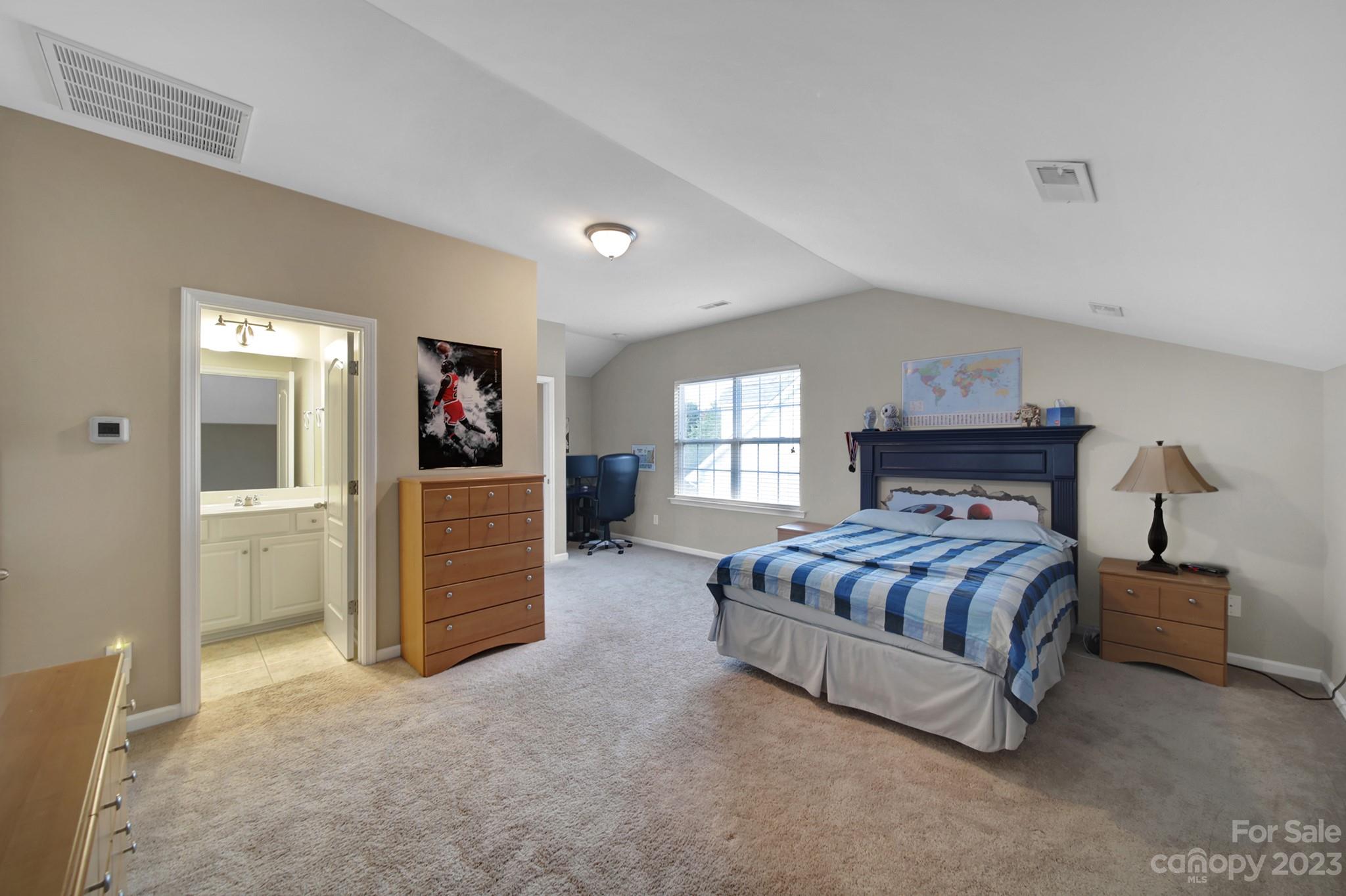 818 Treasure Court Fort Mill, SC 29708 - Photo 18 of 47 a bedroom with a bed and a couch
