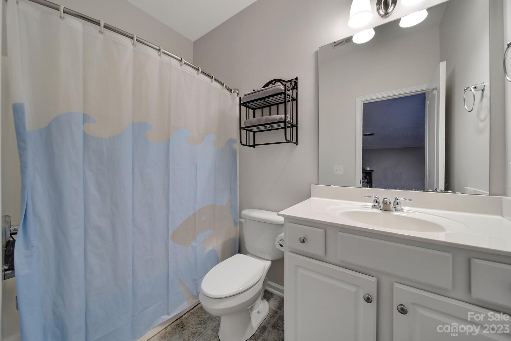818 Treasure Court Fort Mill, SC 29708 - Photo 19 of 47 a bathroom with a toilet sink and mirror