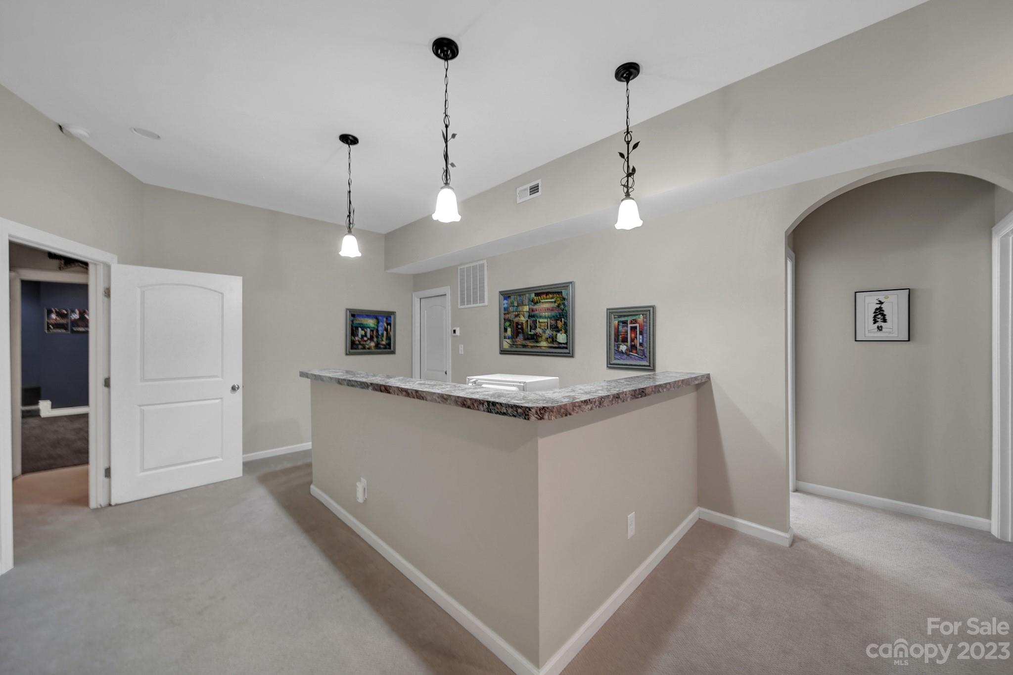 818 Treasure Court Fort Mill, SC 29708 - Photo 25 of 47 a kitchen with kitchen island a sink stainless steel appliances and window
