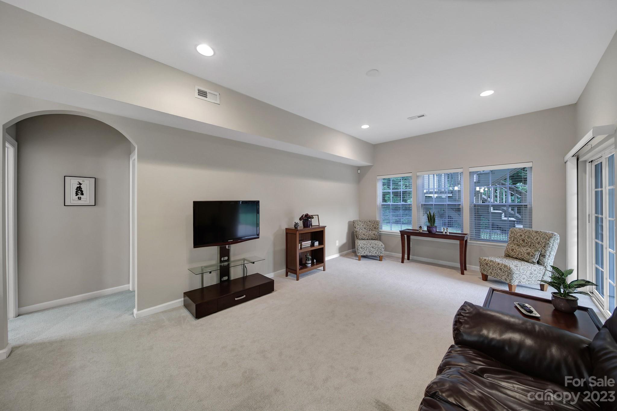 818 Treasure Court Fort Mill, SC 29708 - Photo 26 of 47 a living room with furniture and a flat screen tv