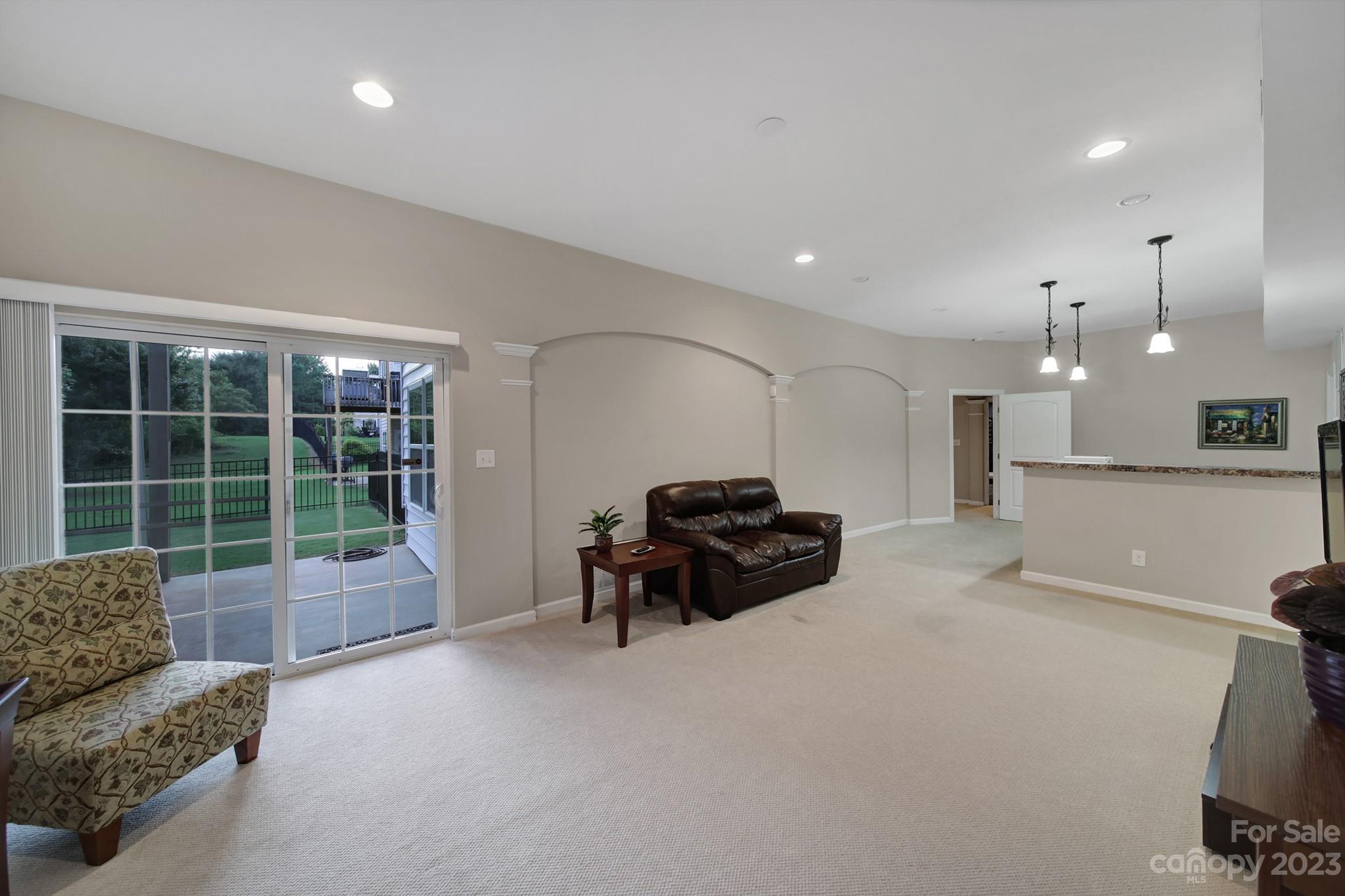 818 Treasure Court Fort Mill, SC 29708 - Photo 27 of 47 a living room with furniture and a large window