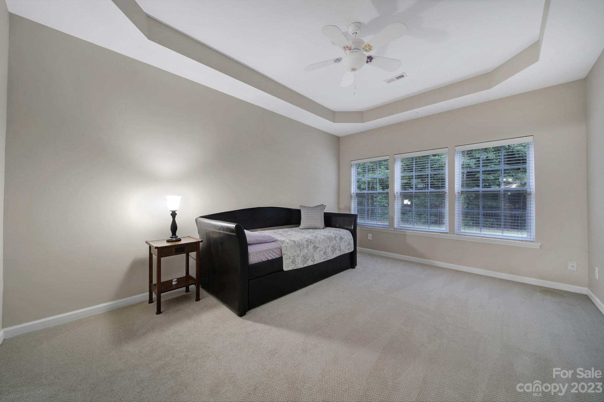 818 Treasure Court Fort Mill, SC 29708 - Photo 29 of 47 a spacious bedroom with a bed and a large window