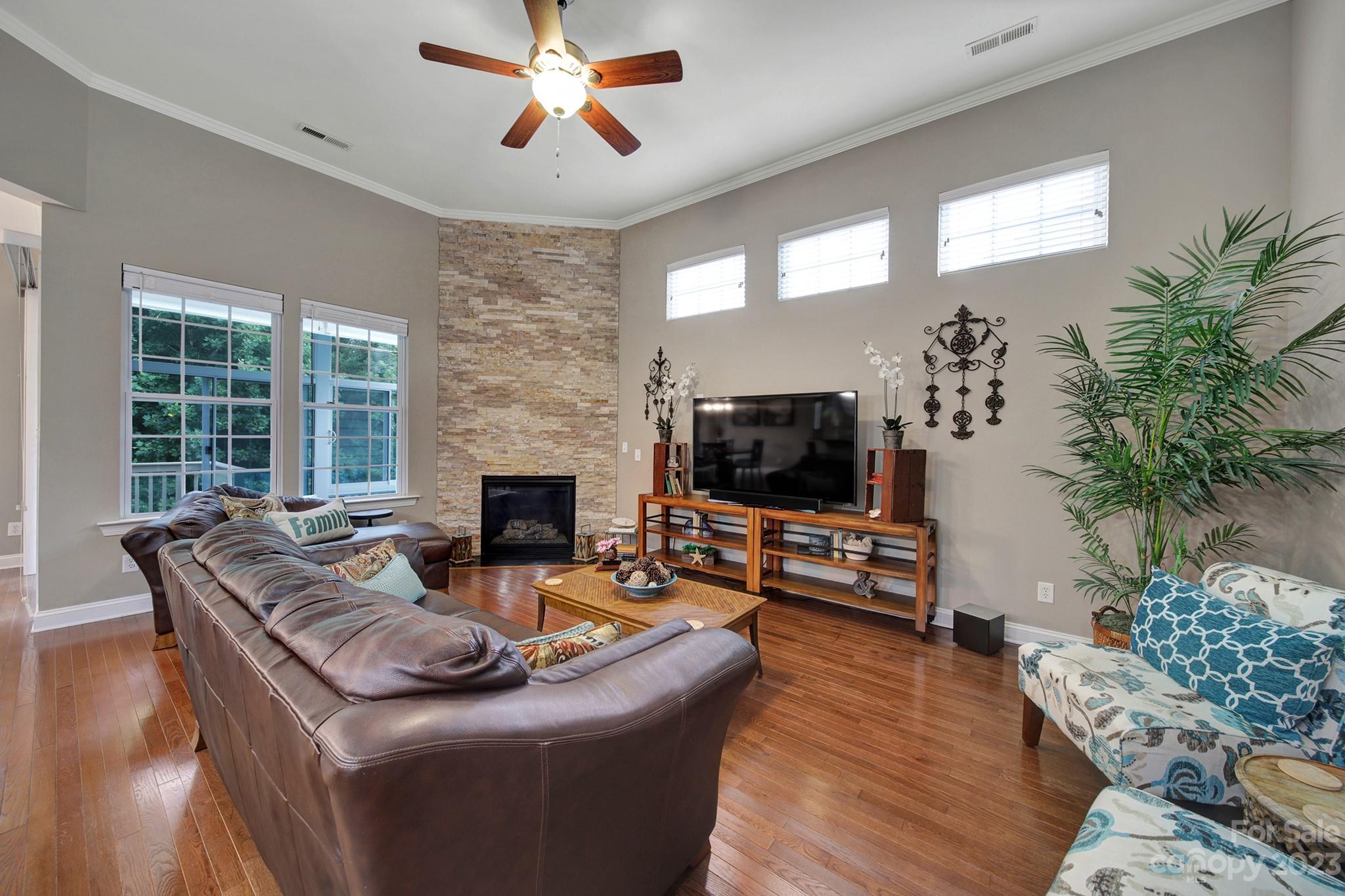 818 Treasure Court Fort Mill, SC 29708 - Photo 3 of 47 a living room with furniture and a flat screen tv