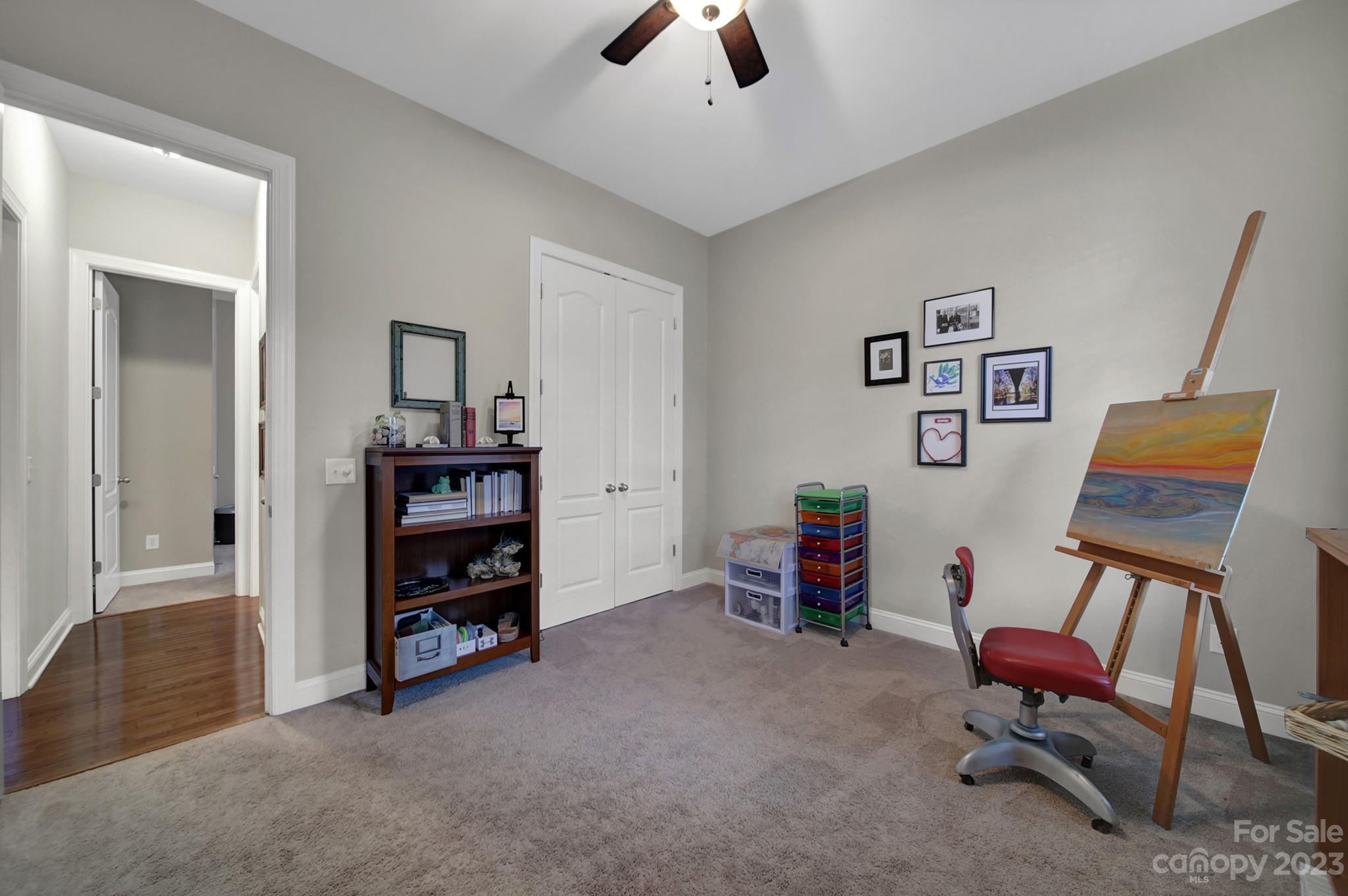 818 Treasure Court Fort Mill, SC 29708 - Photo 32 of 47 a view of a workspace with furniture and a ceiling fan
