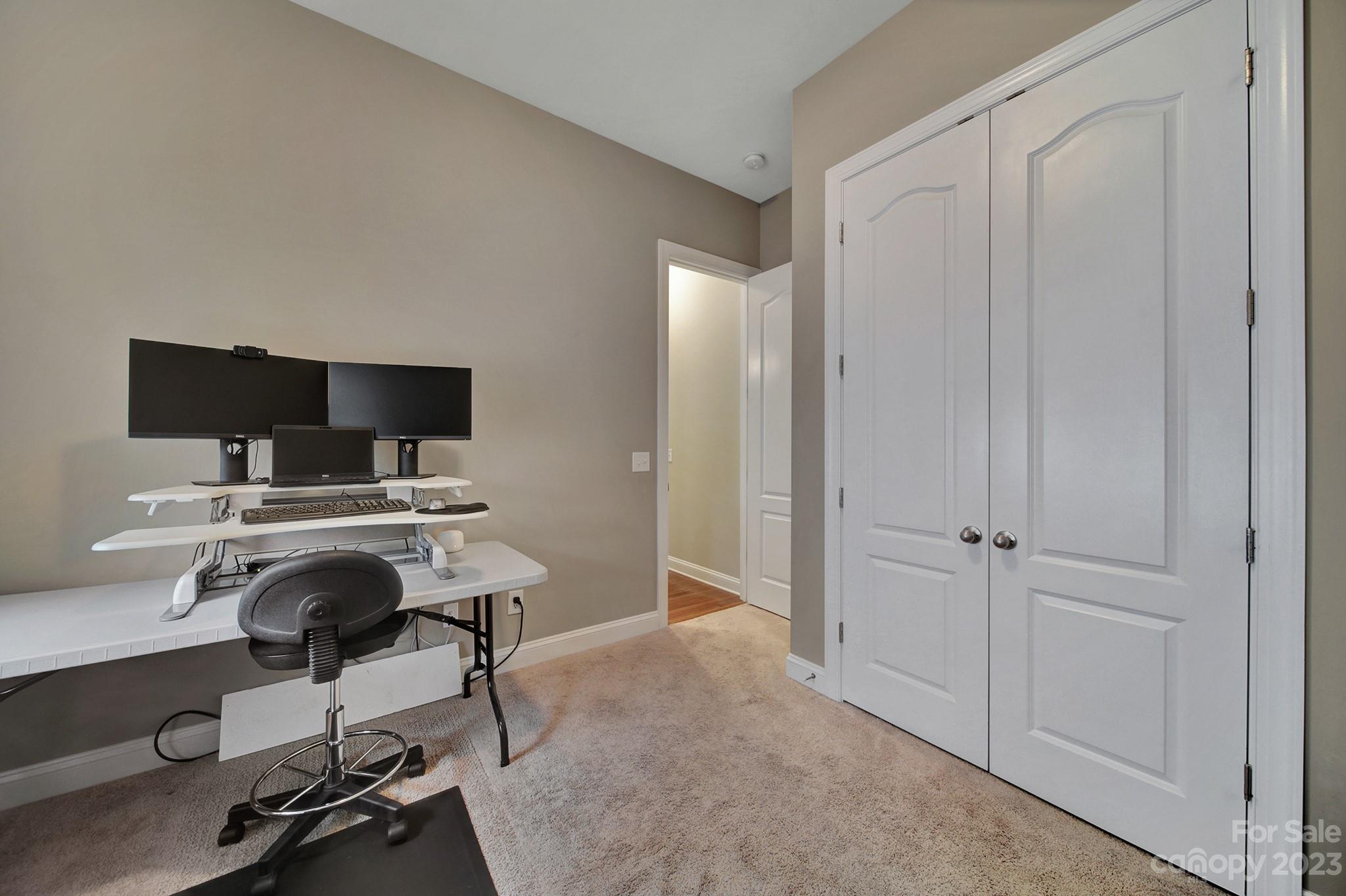 818 Treasure Court Fort Mill, SC 29708 - Photo 34 of 47 a view of a workspace with furniture and a window