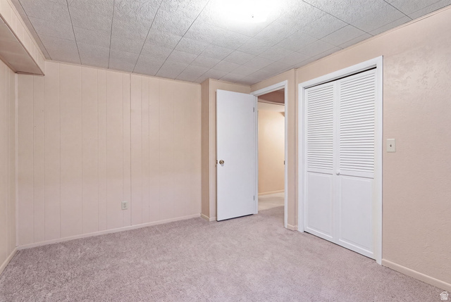 2524 Camelback Road Cottonwood Heights, UT 84121 - Photo 38 of 49 Carpeted flooring, paneled wall detail, textured ceiling, louvered bi-fold closet doors, and interior door