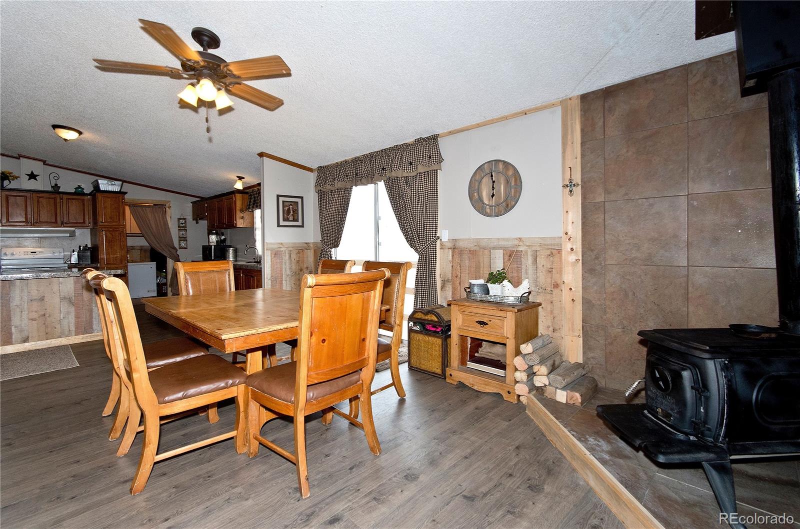 9780 Hahn Road Calhan, CO 80808 - Photo 2 of 24 a dining room with furniture and window