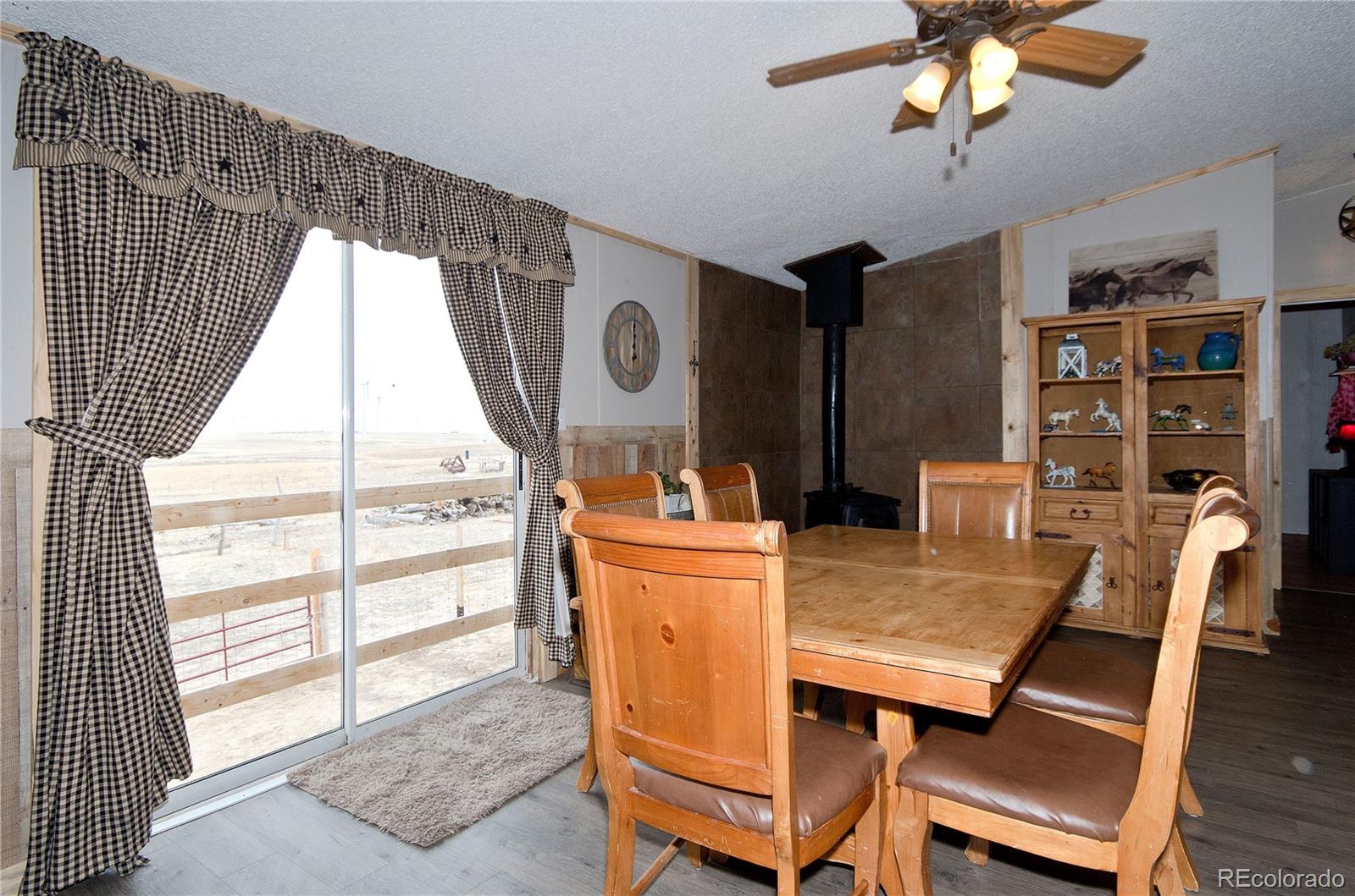 9780 Hahn Road Calhan, CO 80808 - Photo 3 of 24 a dining room with furniture and window