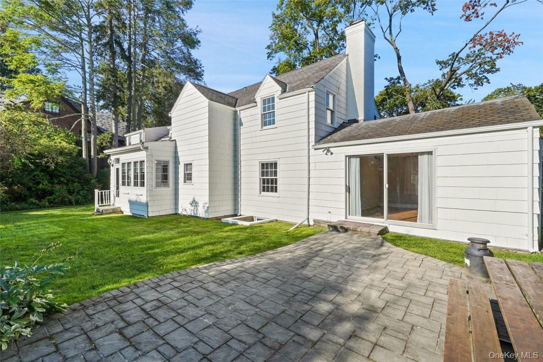 246 Mamaroneck Road Scarsdale, NY 10583 - Photo 34 of 35 Back of property with a yard and a patio area