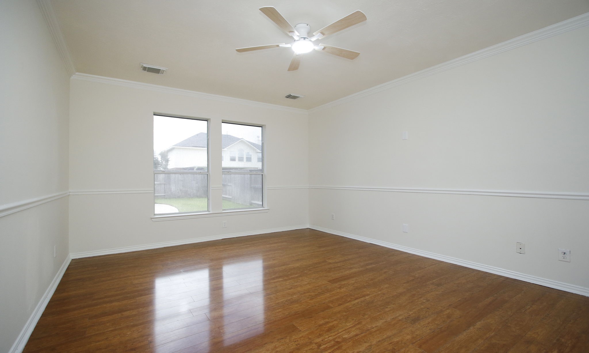 1210 Berwick Manor Court Spring, TX 77379 - Photo 28 of 50 an empty room with a window and a ceiling fan