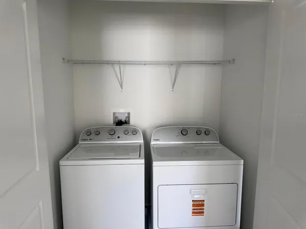 a utility room with dryer and washer