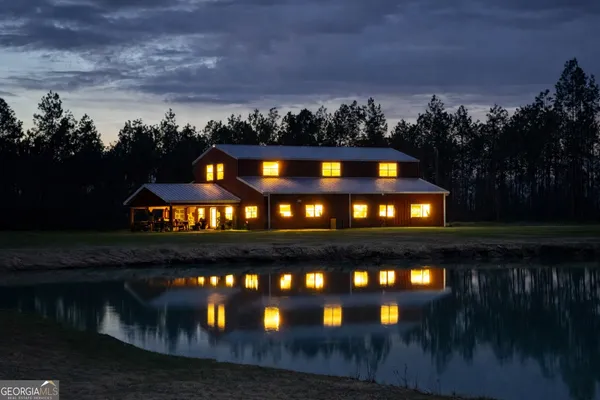 a view of a swimming pool and a yard