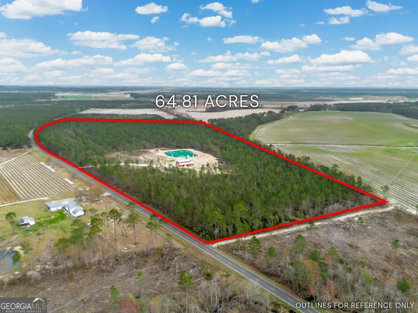 a kitchen with stainless steel appliances granite countertop a refrigerator a sink dishwasher a stove and a refrigerator with wooden floor