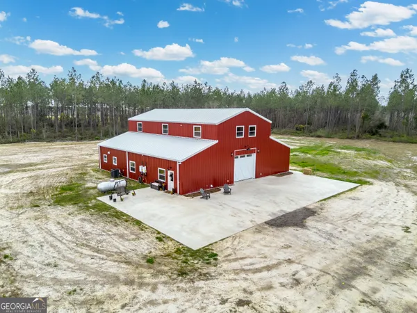 a kitchen with a sink and a large window