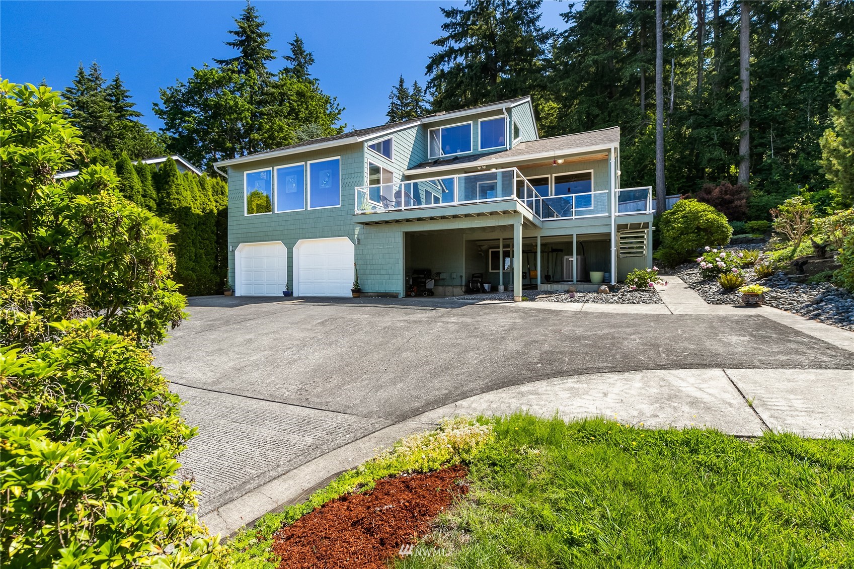 1415 37th Street Bellingham, WA 98229 - Photo 1 of 37 a front view of a house with a garden