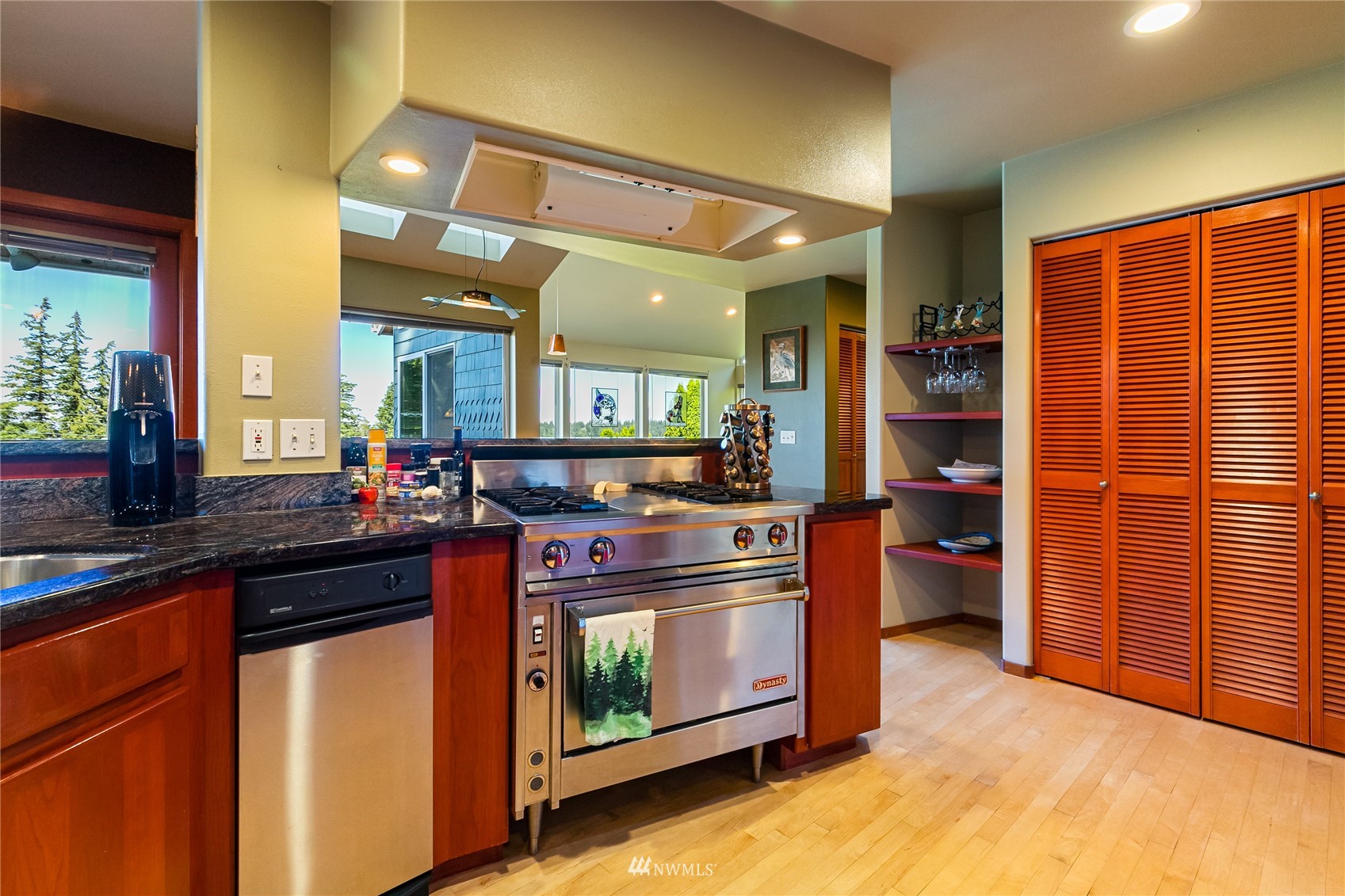 1415 37th Street Bellingham, WA 98229 - Photo 14 of 37 a kitchen with stainless steel appliances granite countertop a stove a sink and a refrigerator