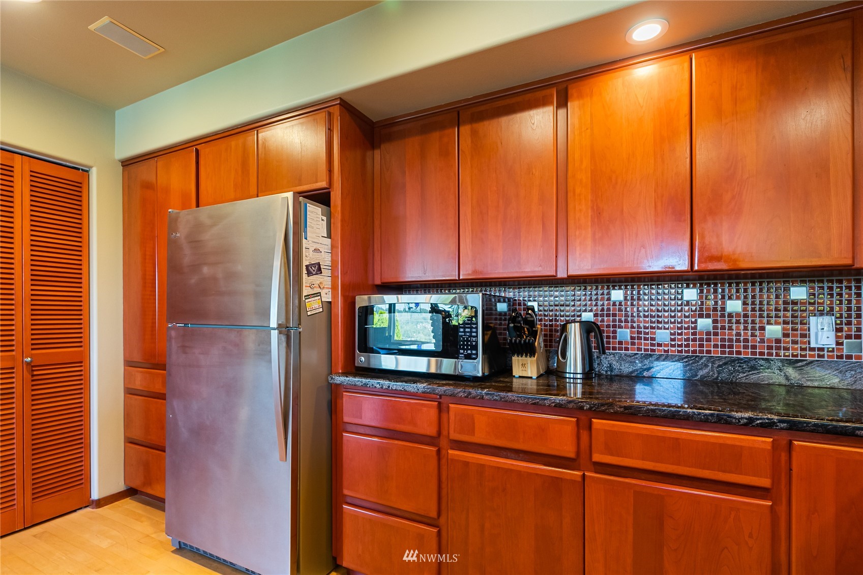 1415 37th Street Bellingham, WA 98229 - Photo 15 of 37 a kitchen with stainless steel appliances granite countertop a refrigerator and a sink