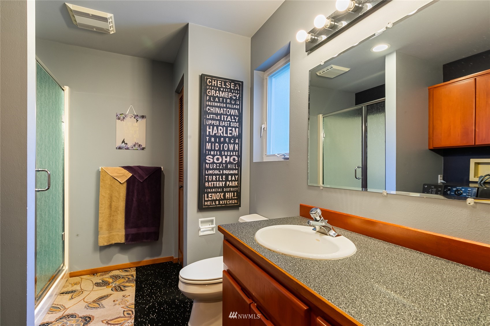 1415 37th Street Bellingham, WA 98229 - Photo 22 of 37 a bathroom with a granite countertop sink and a mirror